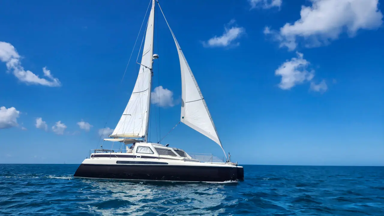 Bliss under full sail on a bright blue Caribbean sea